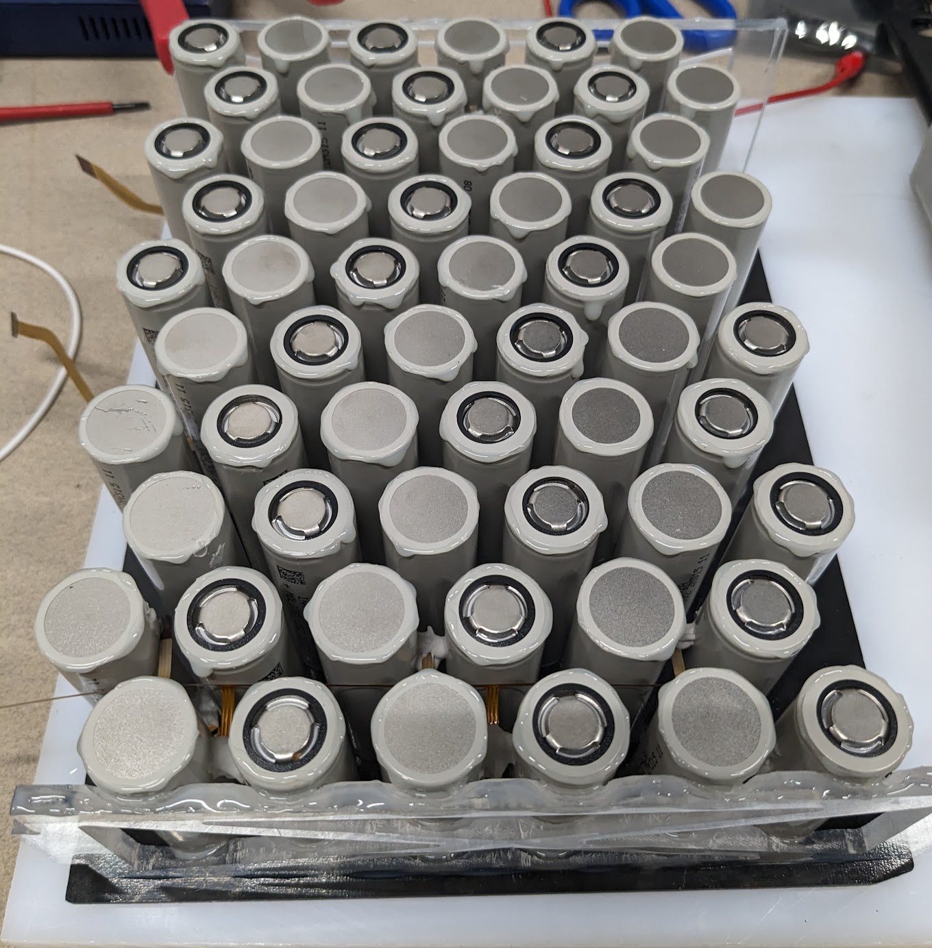 A module with epoxy on the cells waiting for the top plate to be installed