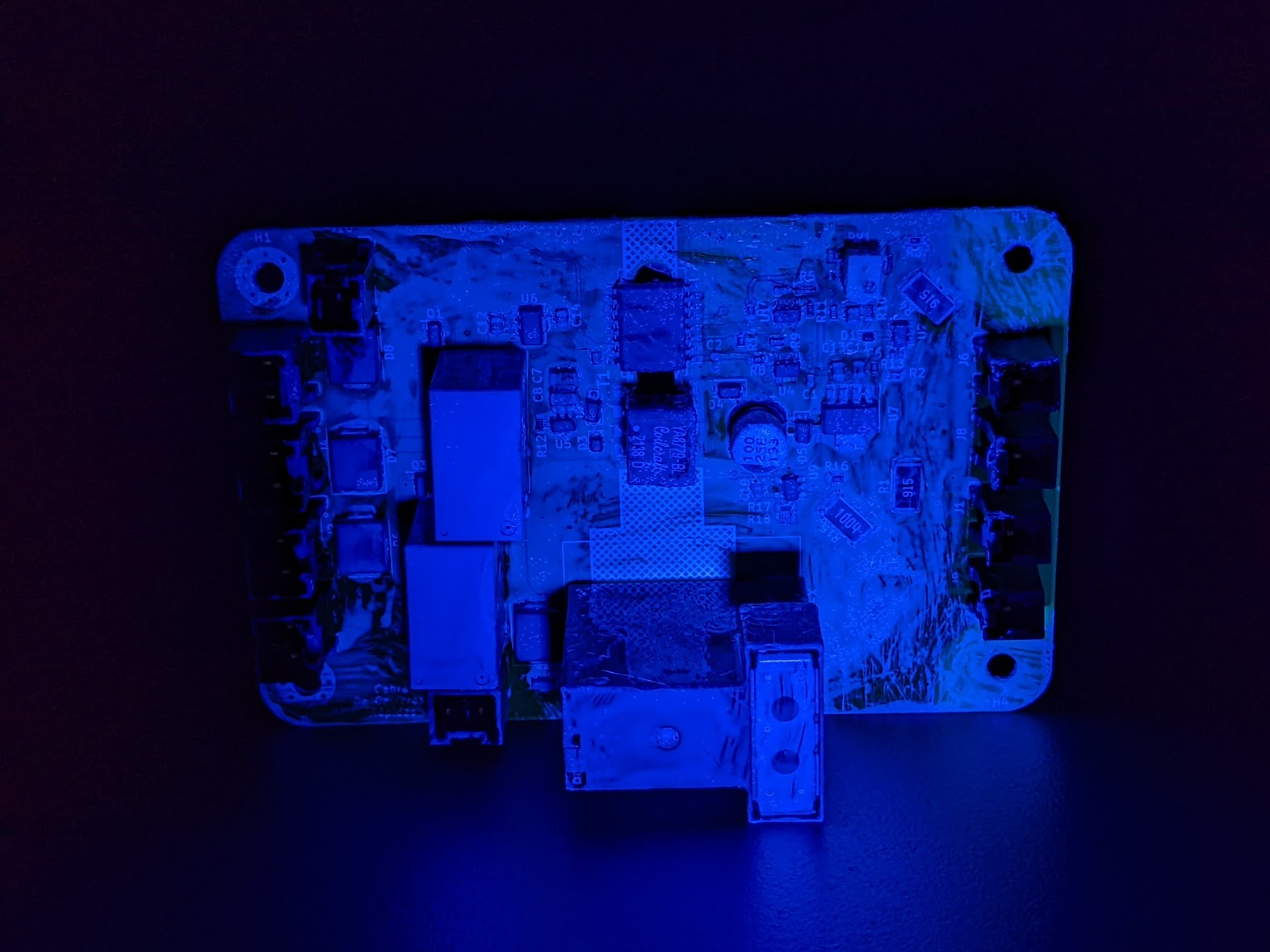 one of our pcbs (this image is under uv to demonstrate conformal coat)